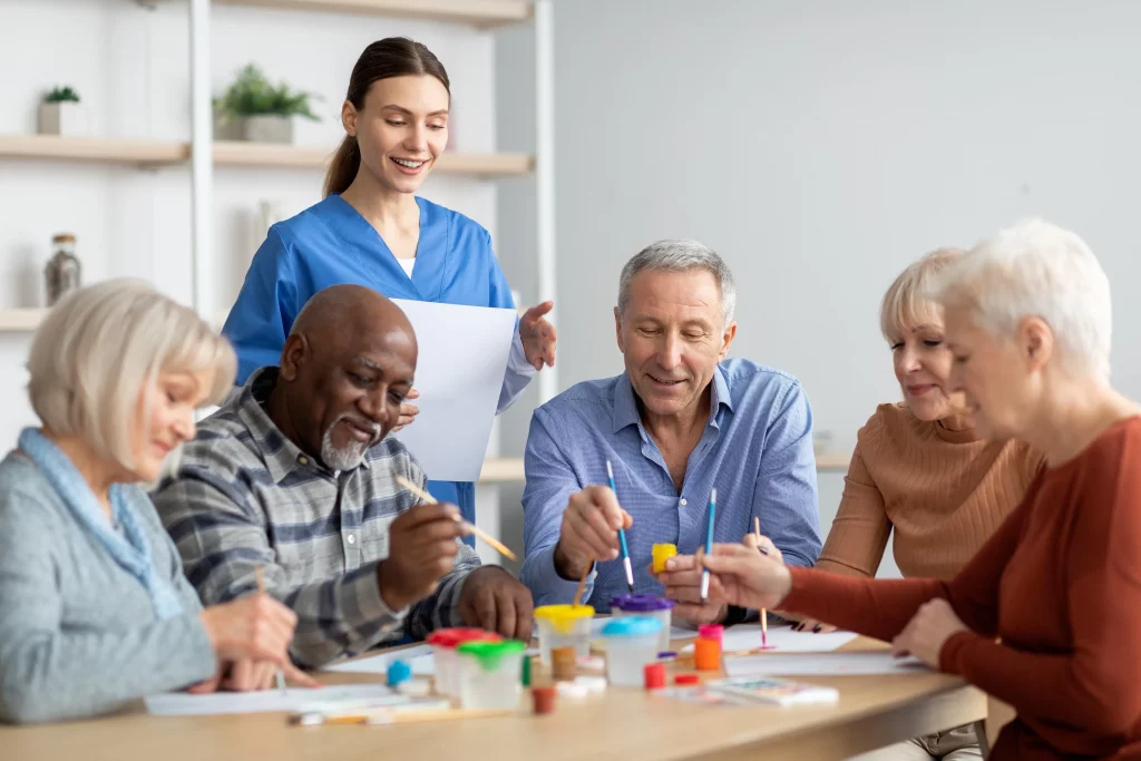 A group of seniors working together at a table.
