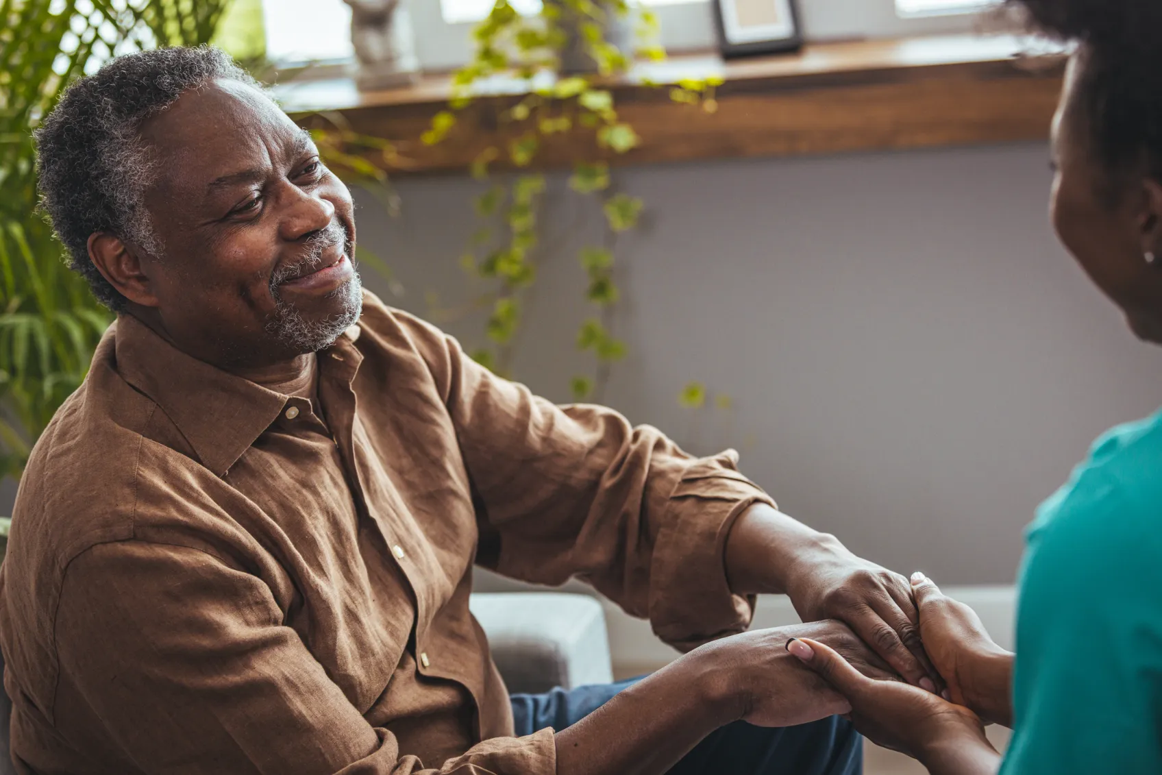 An elderly black smiling man.