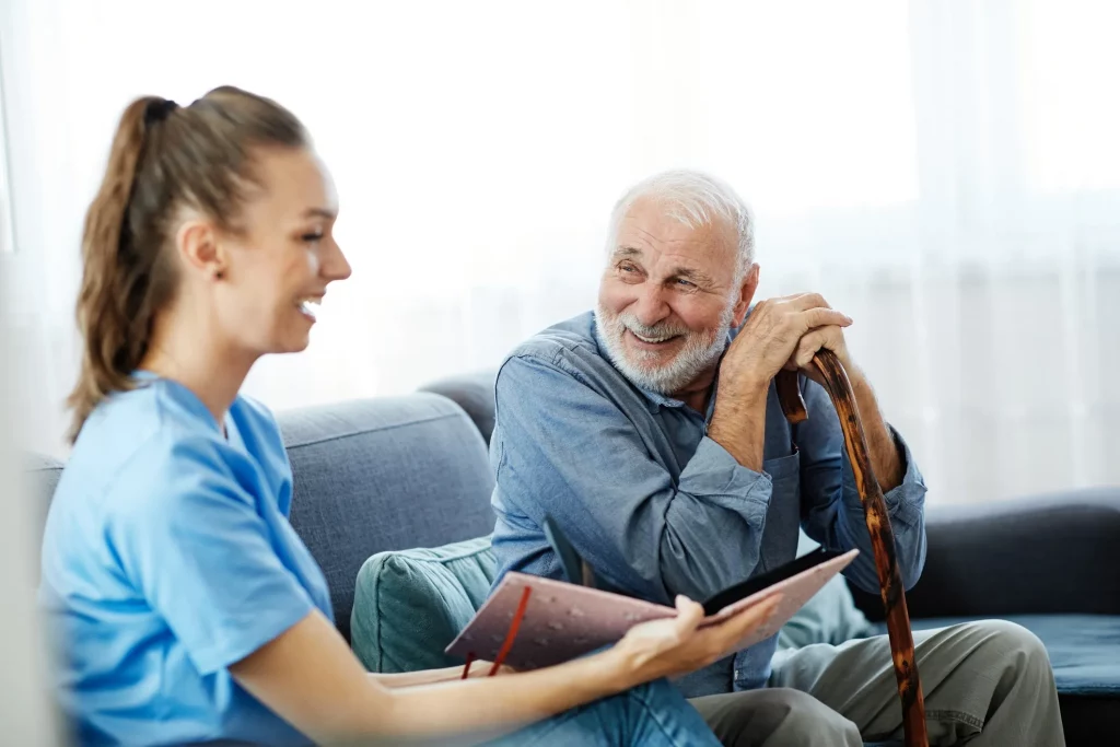 Home nurse working with an elderly man.