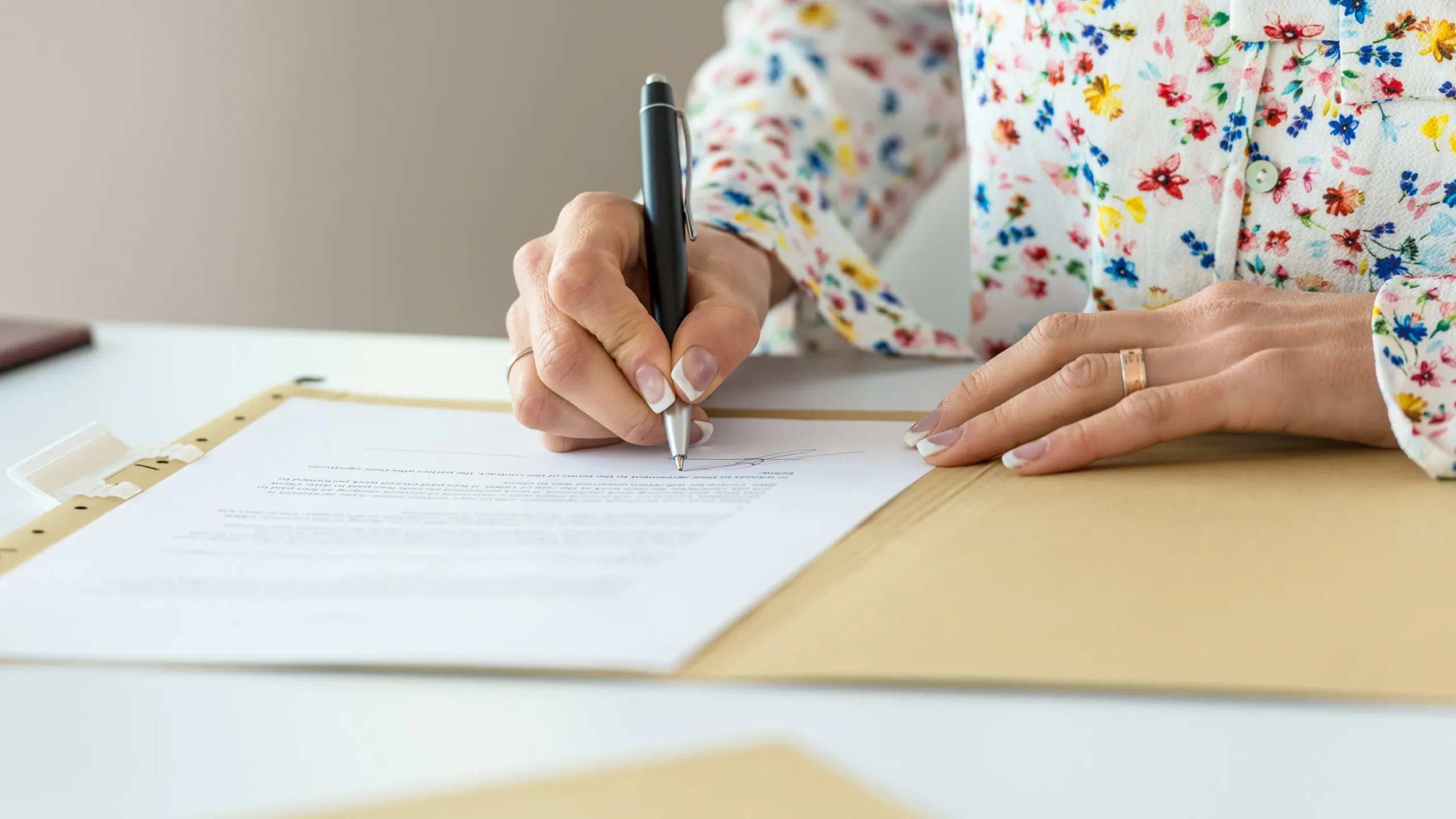 A person filling out paperwork.